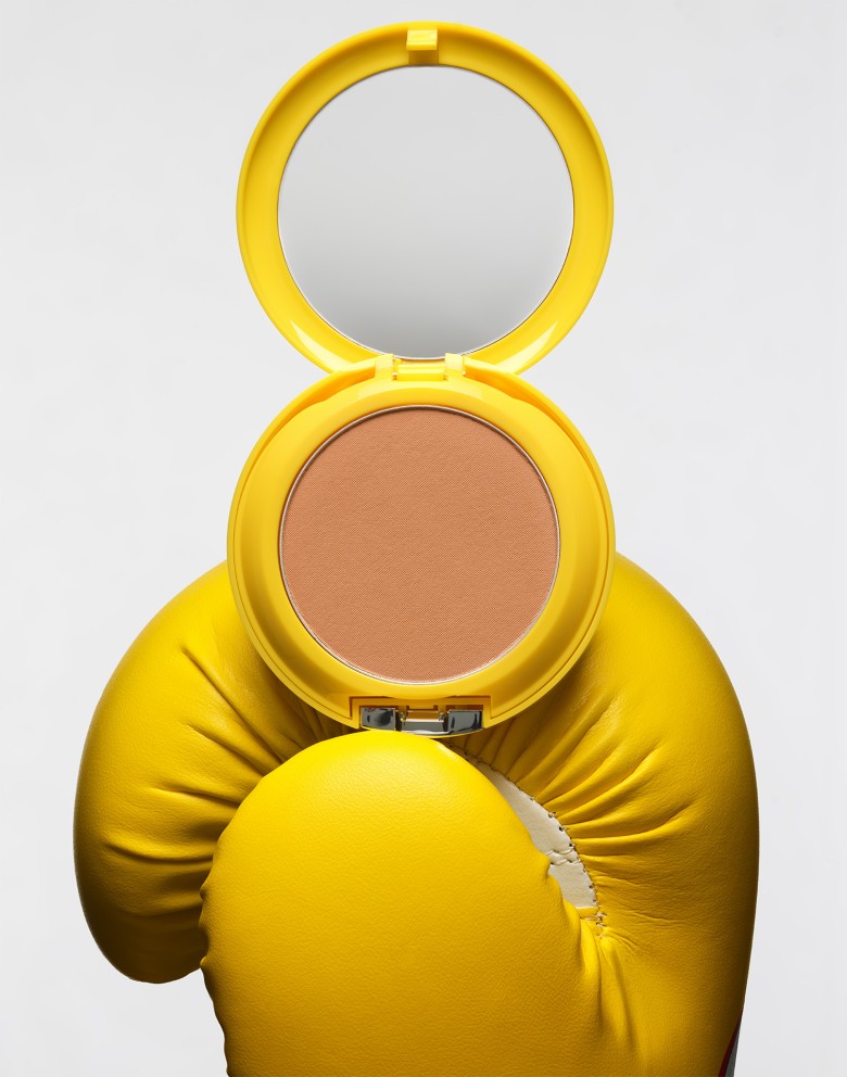 Yellow clinique makeup with yellow boxing gloves by sofus graae